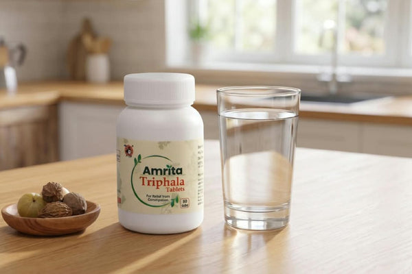 Triphala powder with a glass of water showing how to take Triphala